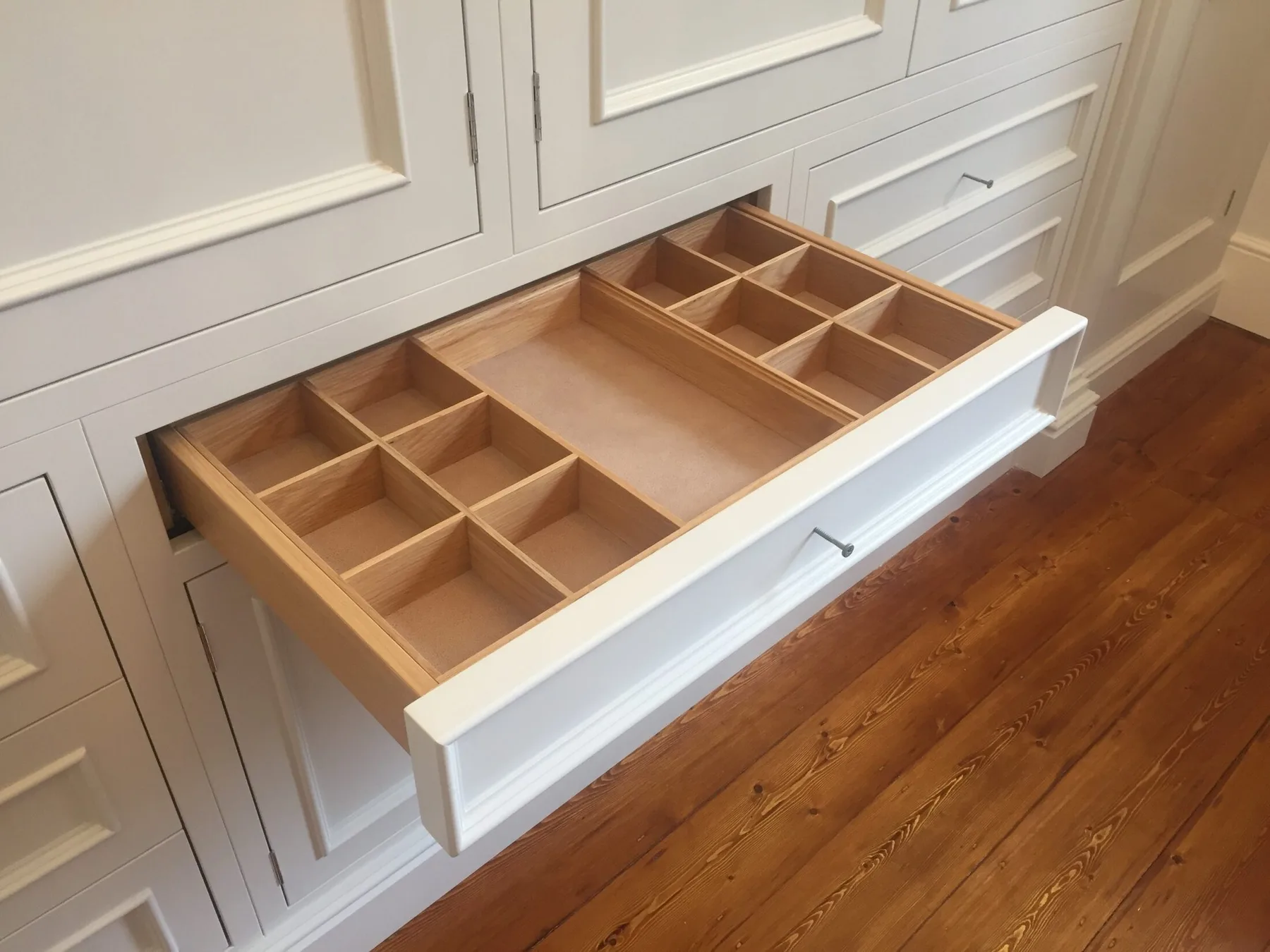 A solid timber cutlery drawer fitted within a Corinthian kitchen